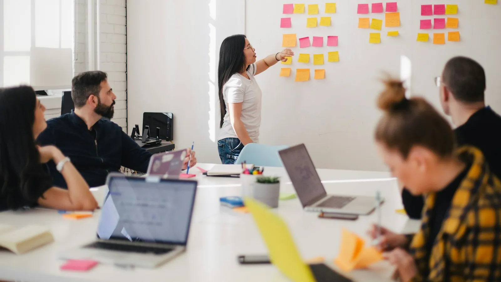 Team workshop with sticky notes on a wall